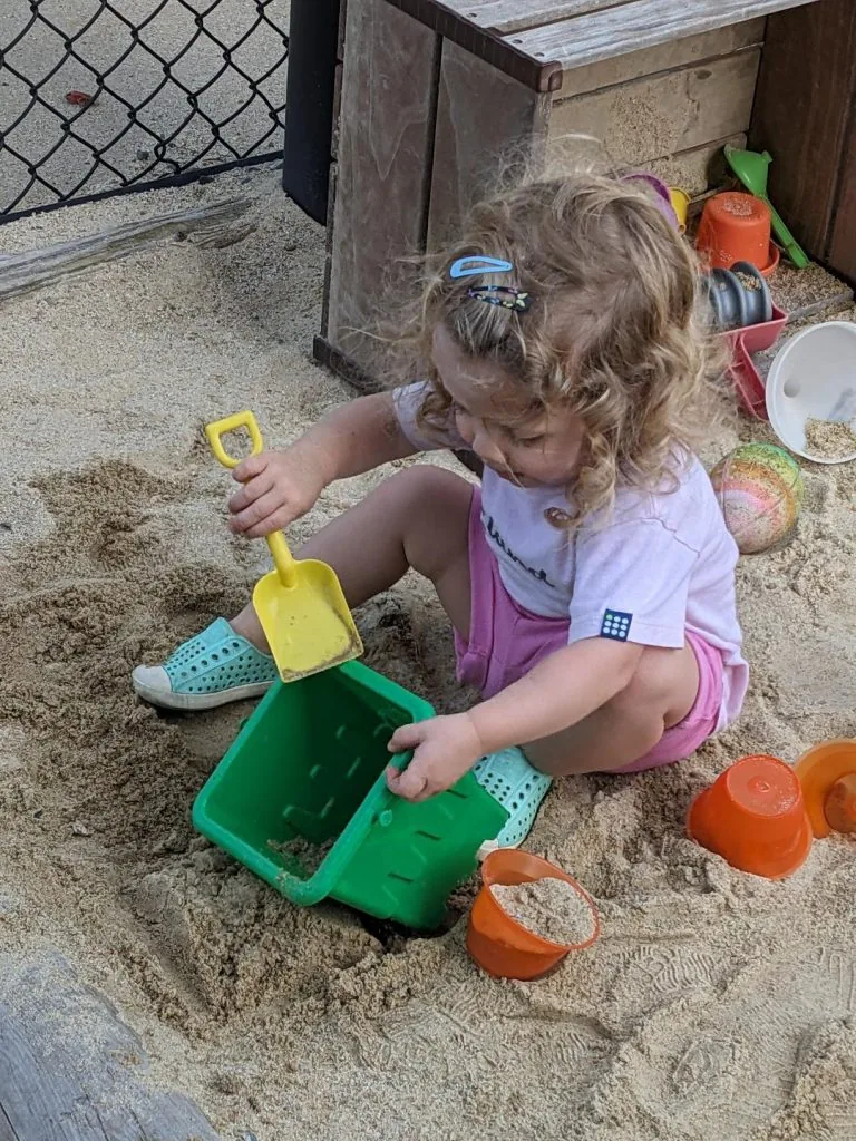 A child playing and learning at Blossom Station