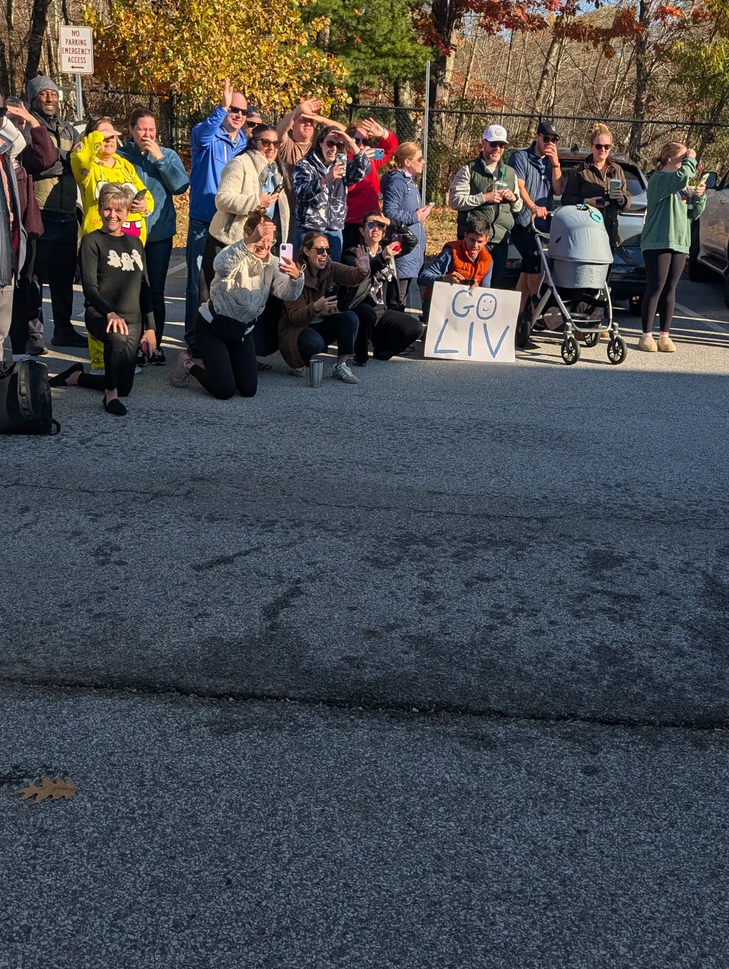 Families gathered in the parking lot cheering at the end of the 2026 Halloween Parade