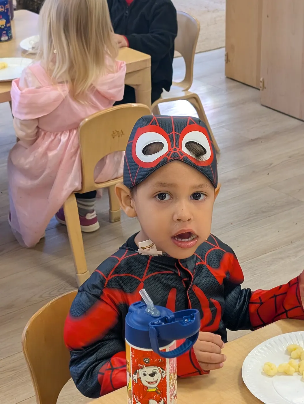 A preschooler in a Spider-Man costume at the Blossom Station Halloween party