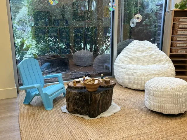 A cozy nature corner with natural materials in a Blossom Station classroom